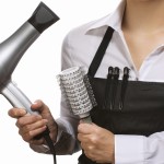 Hairdresser in uniform with working tools